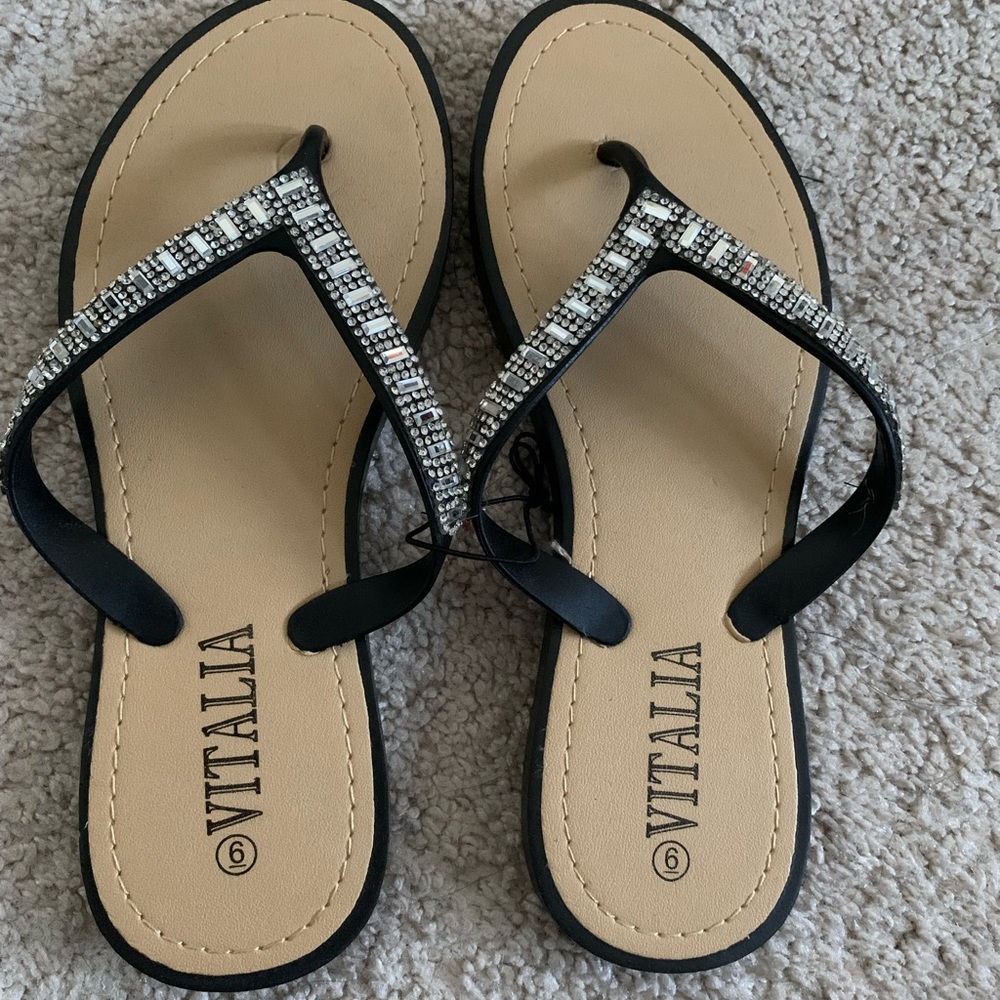 Rhinestone embellished flip flops in black